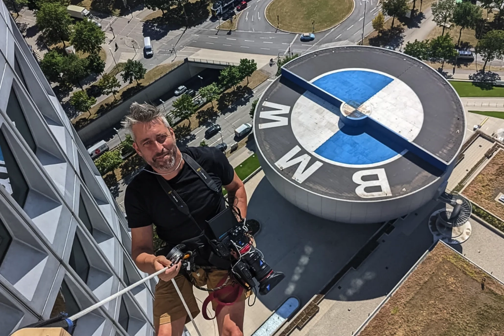 Greg Bernstein Rapelling The BMW Headquarters Building in Munich Germany.