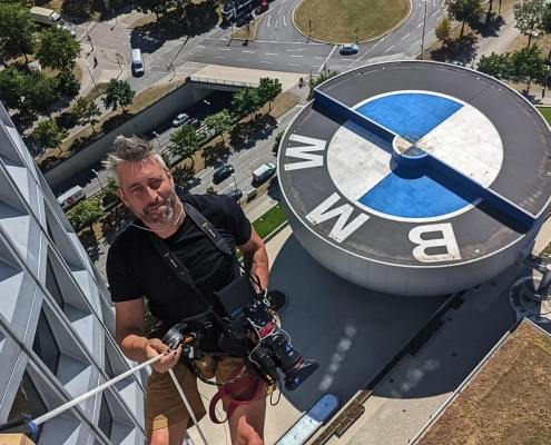 Greg Bernstein Rapelling The BMW Headquarters Building in Munich Germany.