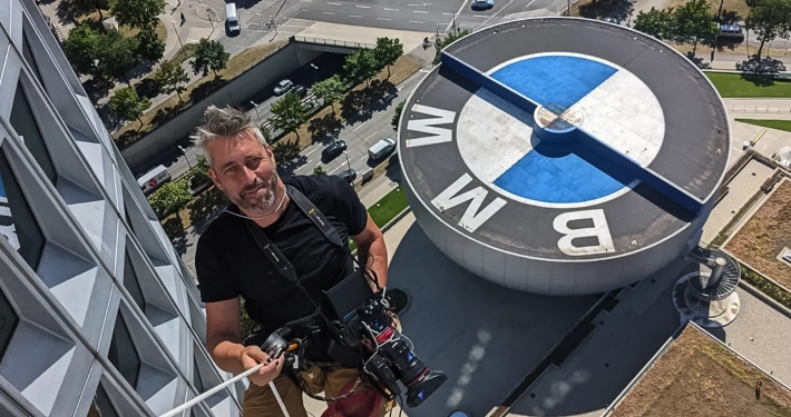 Greg Bernstein Rapelling The BMW Headquarters Building in Munich Germany.
